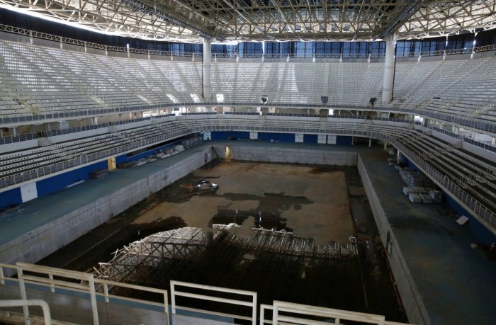 inside-the-aquatic-center-the-pool-is-drained-except-for-some-unpleasant-standing-water